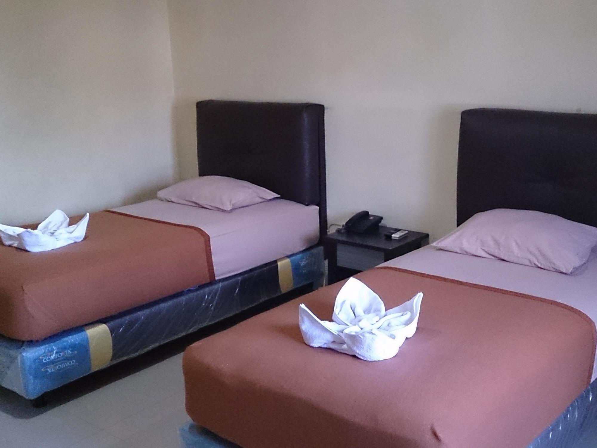 Quint Hotel Manado Buitenkant foto